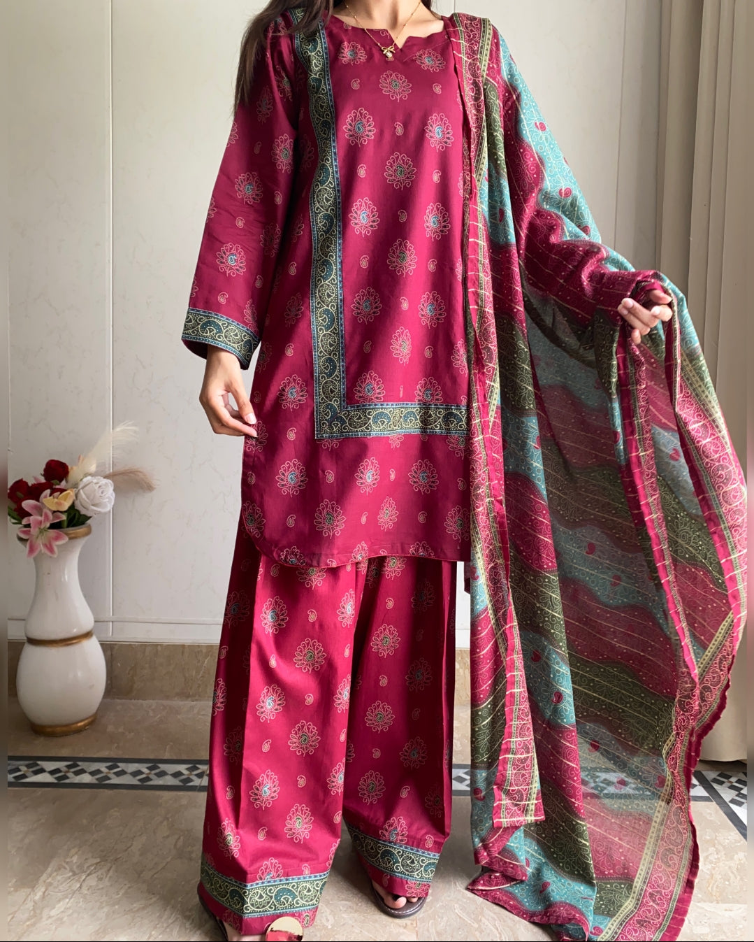  A pink traditional outfit with a matching dupatta in a room setting.
From Bin Saeed Summer collection